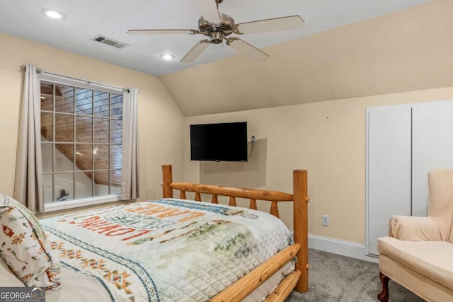 carpeted bedroom featuring vaulted ceiling and ceiling fan