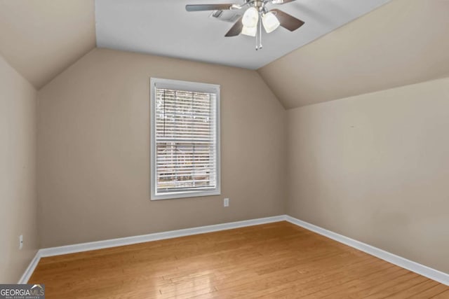 bonus room featuring ceiling fan, light hardwood / wood-style flooring, and vaulted ceiling