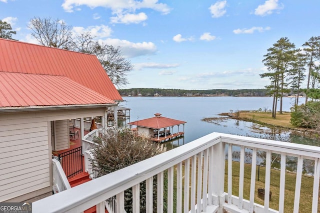 wooden deck with a water view