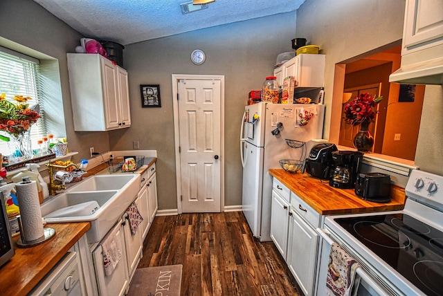 kitchen with wooden counters, white appliances, white cabinetry, and a textured ceiling