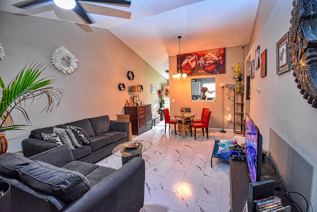 living room with ceiling fan and vaulted ceiling