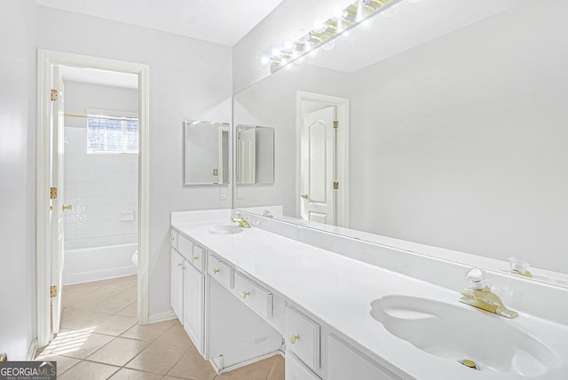 bathroom with tiled shower / bath, vanity, and tile patterned flooring