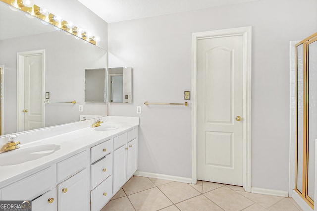 bathroom with vanity, tile patterned floors, and a shower with shower door