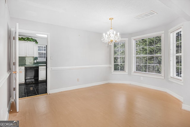 interior space with light hardwood / wood-style flooring and a notable chandelier