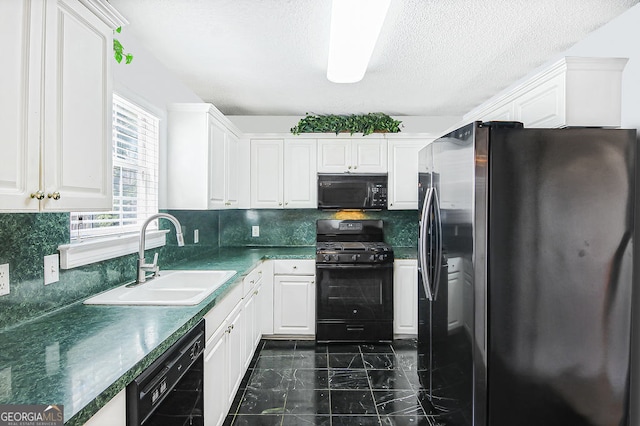 kitchen with white cabinets, sink, decorative backsplash, and black appliances