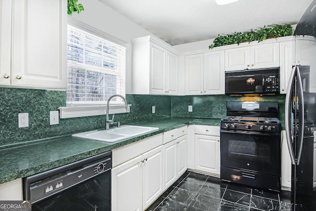 kitchen with tasteful backsplash, white cabinets, sink, and black appliances