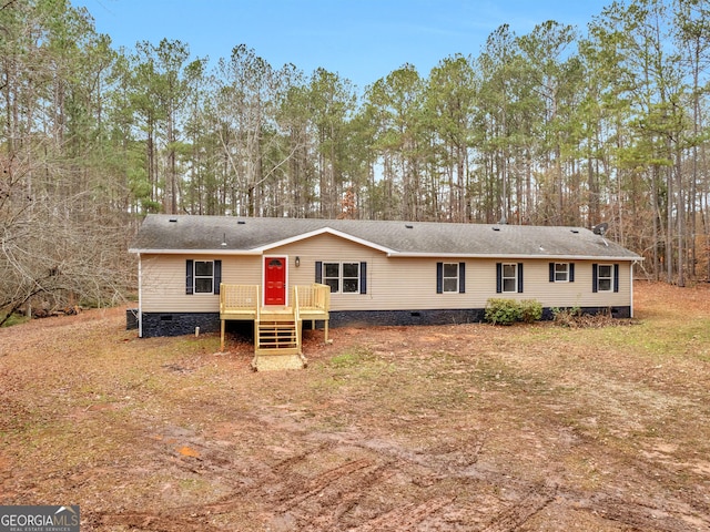 manufactured / mobile home featuring a wooden deck