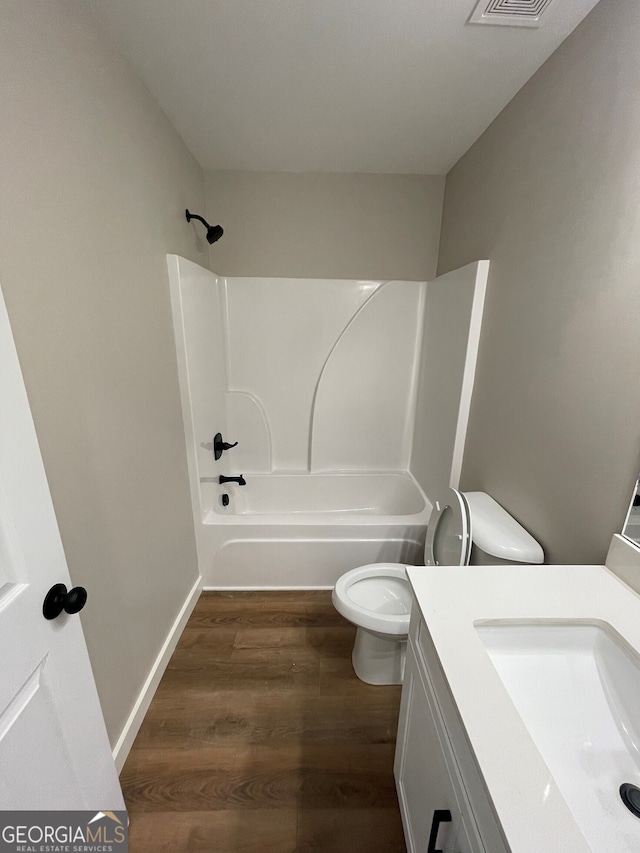 410 Hardy Ave SW, Rome, GA 30161 - bathroom featuring vanity, shower / tub combination, toilet, visible vents, and wood finished floors