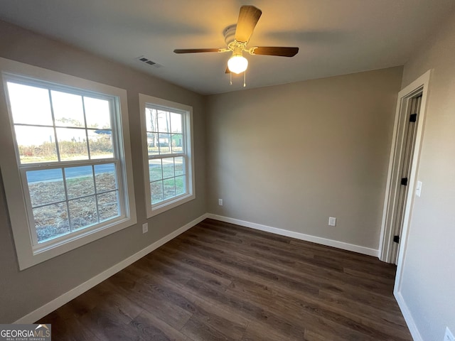 410 Hardy Ave SW, Rome, GA 30161 - unfurnished room featuring ceiling fan, visible vents, baseboards, and dark wood finished floors