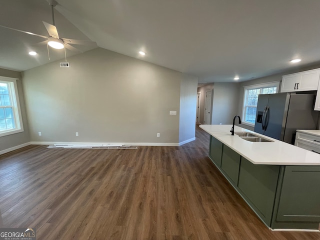 410 Hardy Ave SW, Rome, GA 30161 - kitchen featuring fridge with ice dispenser, baseboards, visible vents, a center island with sink, and a sink