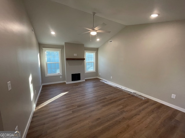 410 Hardy Ave SW, Rome, GA 30161 - unfurnished living room with baseboards, ceiling fan, a fireplace, dark wood-style floors, and lofted ceiling