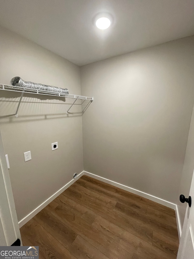 410 Hardy Ave SW, Rome, GA 30161 - laundry room featuring baseboards, dark wood-type flooring, electric dryer hookup, and laundry area