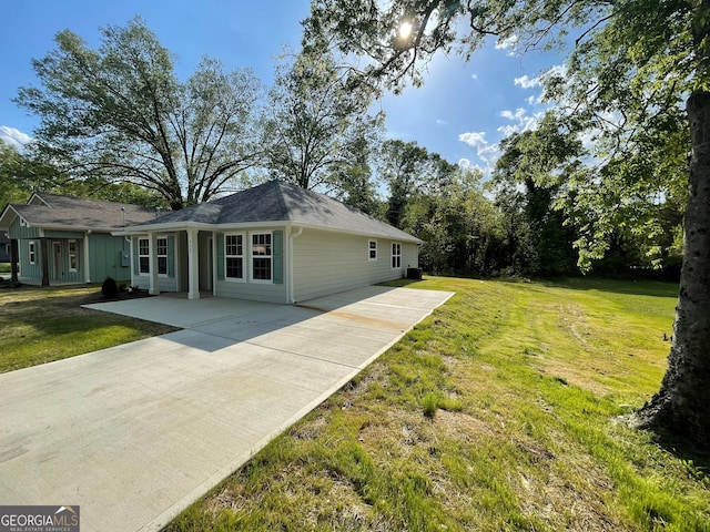 410 Hardy Ave SW, Rome, GA 30161 - view of side of home with a yard, a patio area, and driveway