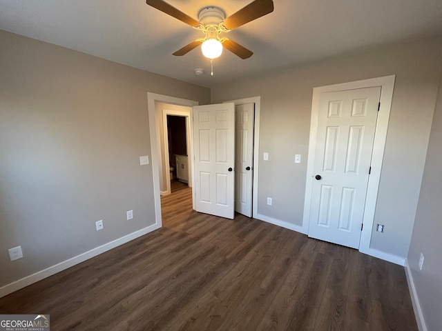 410 Hardy Ave SW, Rome, GA 30161 - unfurnished bedroom featuring dark wood-style floors, baseboards, and ceiling fan