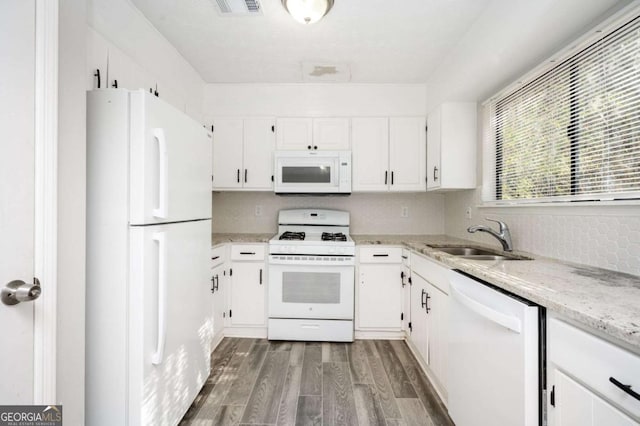 kitchen with dark hardwood / wood-style flooring, sink, white appliances, and white cabinetry