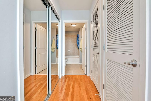 corridor featuring light hardwood / wood-style floors