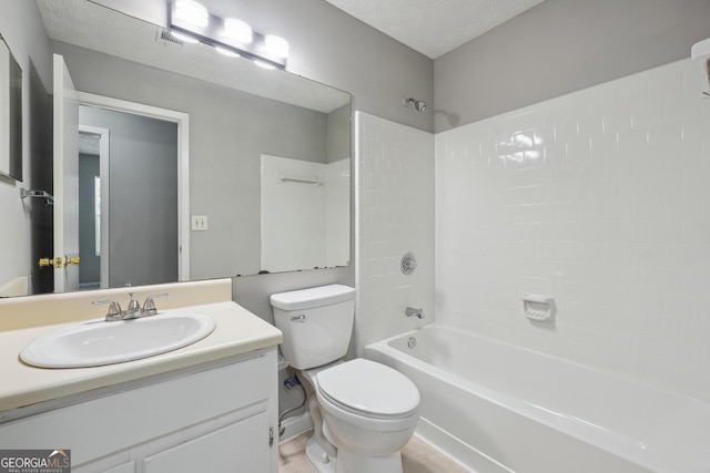 full bathroom with shower / bath combination, toilet, vanity, and a textured ceiling