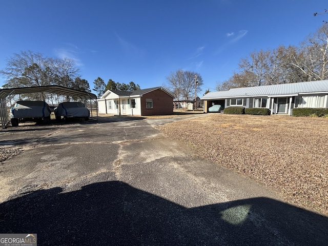 view of front of property featuring a carport