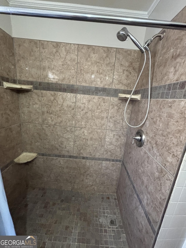 bathroom with a tile shower