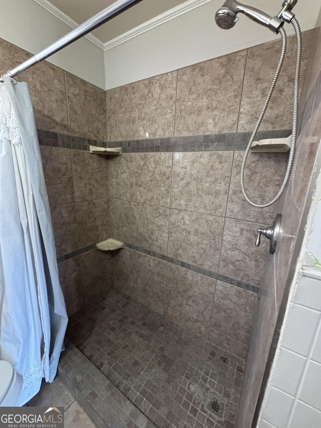 bathroom with tile patterned flooring, a shower with shower curtain, and ornamental molding