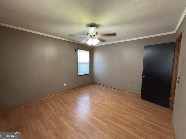 empty room featuring a textured ceiling, ceiling fan, and light hardwood / wood-style floors