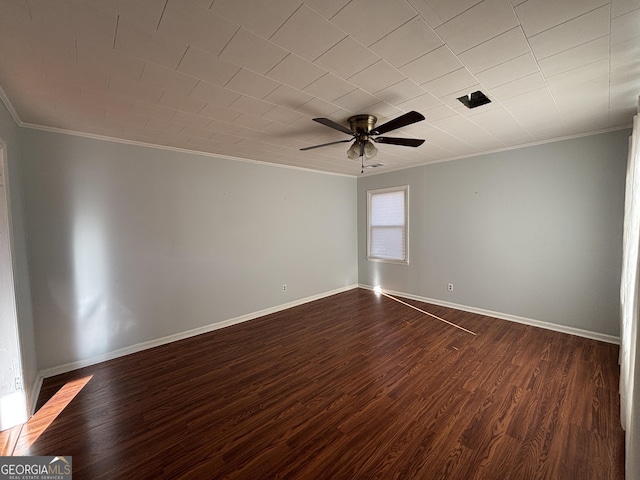 spare room featuring ceiling fan, dark hardwood / wood-style flooring, and ornamental molding