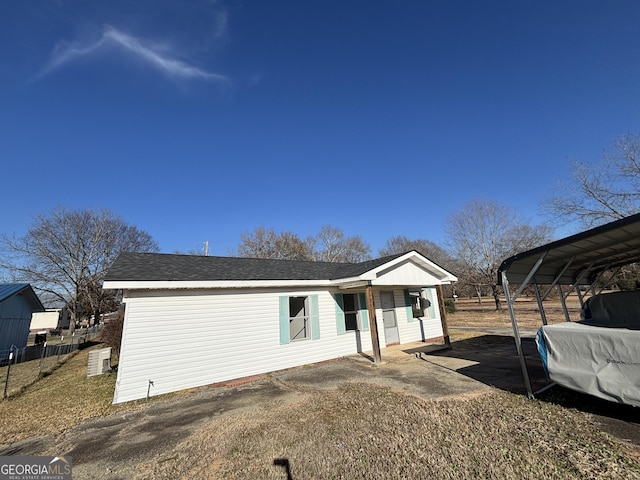 rear view of house with a carport