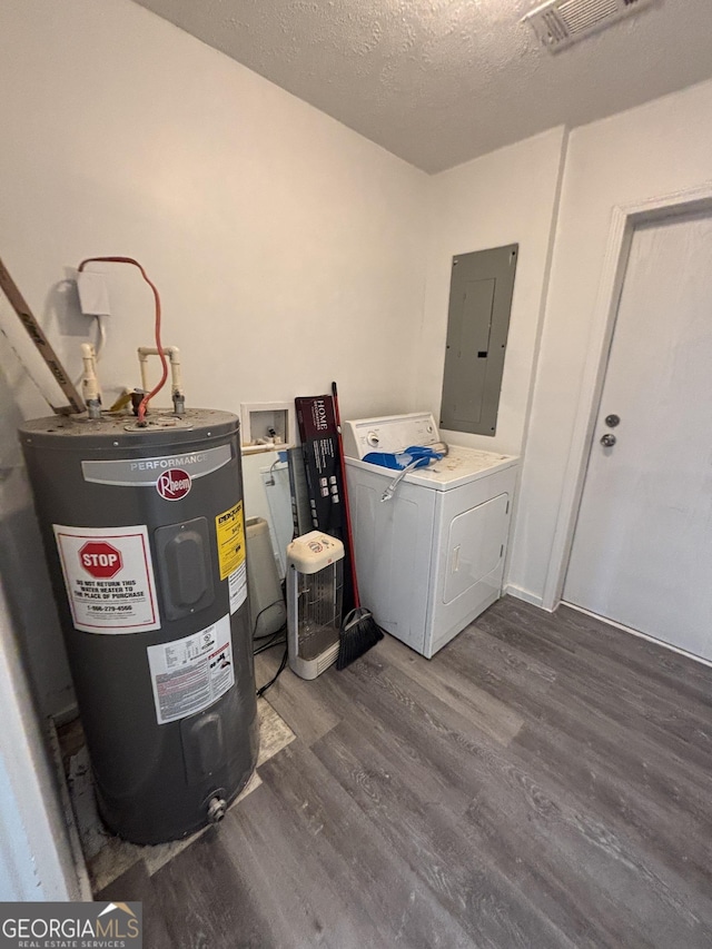 clothes washing area with dark hardwood / wood-style floors, washer / dryer, electric panel, water heater, and a textured ceiling