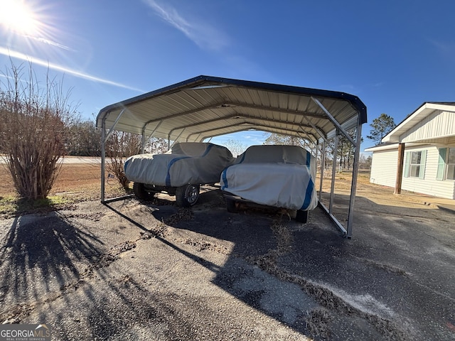 view of vehicle parking featuring a carport