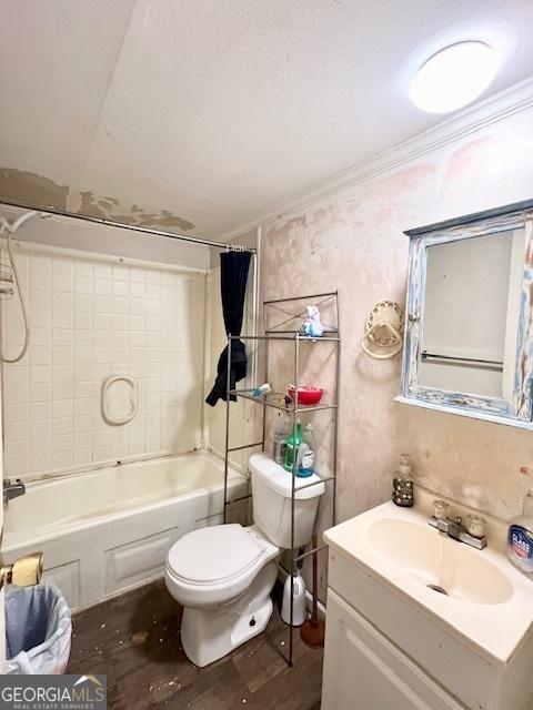 full bathroom with ornamental molding, vanity, toilet, and shower / bath combo