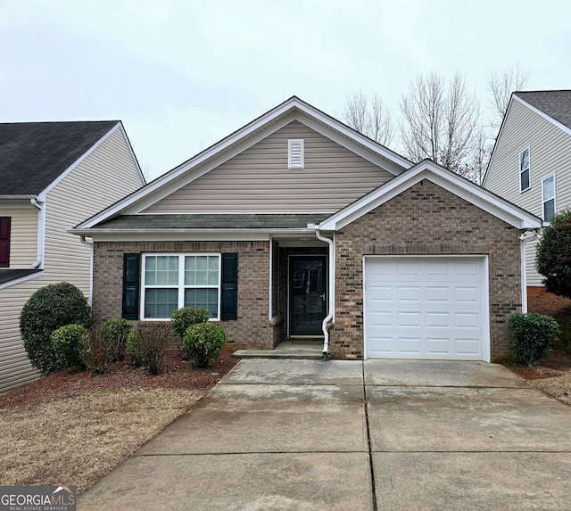 ranch-style house featuring a garage, brick siding, and concrete driveway