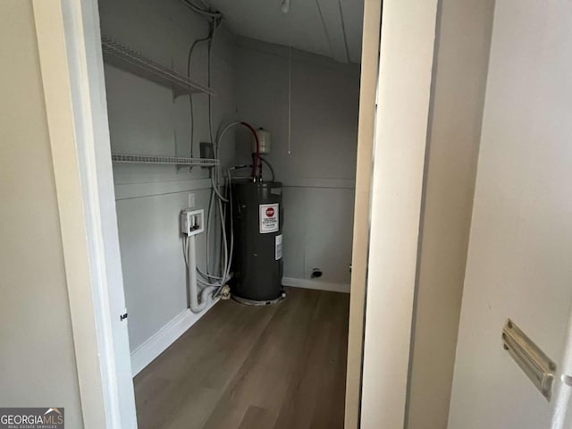 utility room featuring electric water heater