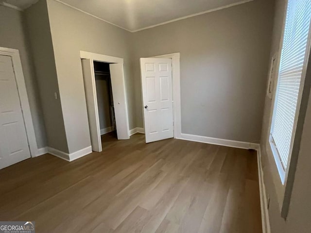 unfurnished bedroom with light wood-type flooring