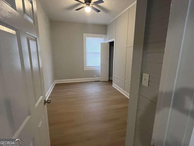 spare room with ceiling fan and dark hardwood / wood-style floors