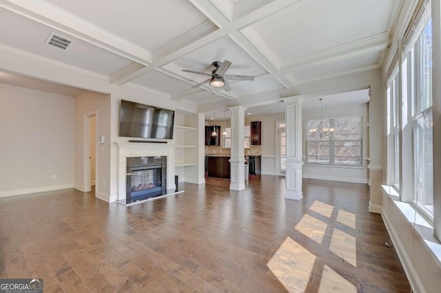 unfurnished living room with dark hardwood / wood-style flooring, ceiling fan with notable chandelier, coffered ceiling, and beamed ceiling