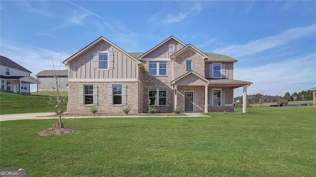 view of front of house featuring covered porch and a front lawn