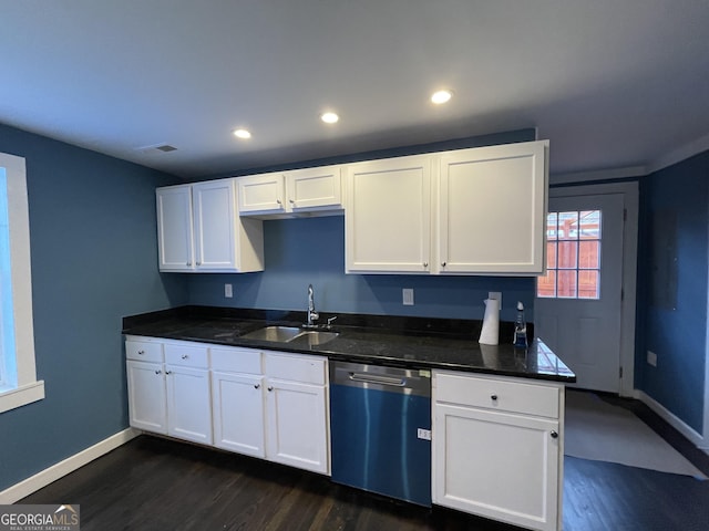 kitchen featuring dark wood-type flooring, sink, white cabinetry, and stainless steel dishwasher