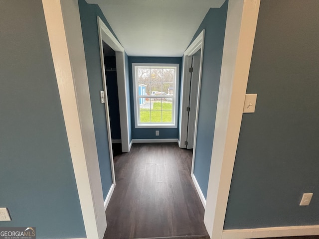 corridor with dark wood-type flooring