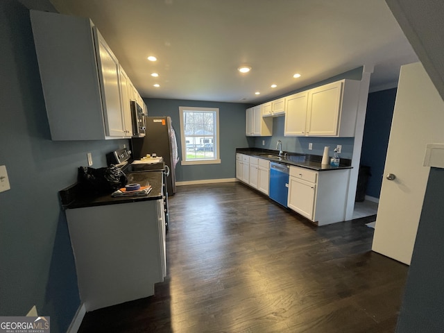 kitchen with white cabinets, dark hardwood / wood-style flooring, sink, and stainless steel appliances