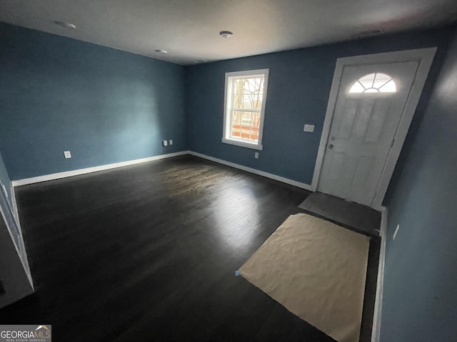 entryway with dark hardwood / wood-style floors