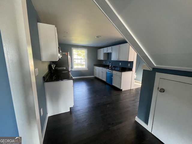 kitchen featuring stainless steel dishwasher, white cabinets, dark hardwood / wood-style flooring, and sink