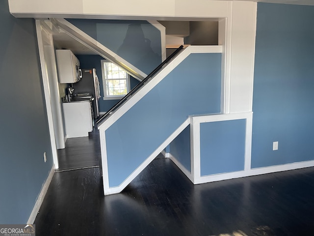 stairs with hardwood / wood-style floors