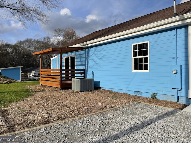 view of home's exterior with cooling unit