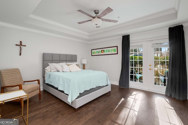 3047 Lenox Rd NE Unit 1108, Atlanta, GA 30324 - bedroom featuring french doors, access to outside, ornamental molding, a tray ceiling, and dark hardwood / wood-style flooring