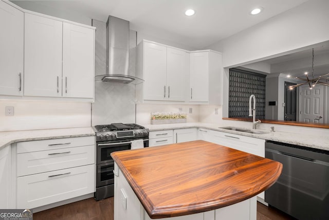3047 Lenox Rd NE Unit 1108, Atlanta, GA 30324 - kitchen with white cabinetry, wall chimney range hood, stainless steel appliances, and sink