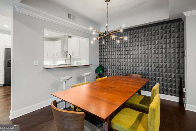 3047 Lenox Rd NE Unit 1108, Atlanta, GA 30324 - dining room featuring ornamental molding and dark wood-type flooring