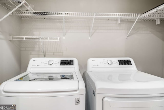 3047 Lenox Rd NE Unit 1108, Atlanta, GA 30324 - clothes washing area featuring independent washer and dryer