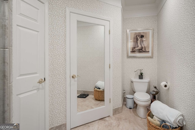 3047 Lenox Rd NE Unit 1108, Atlanta, GA 30324 - bathroom with ornamental molding and toilet