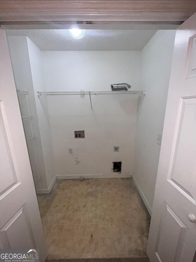 clothes washing area with washer hookup, hookup for an electric dryer, and hookup for a gas dryer