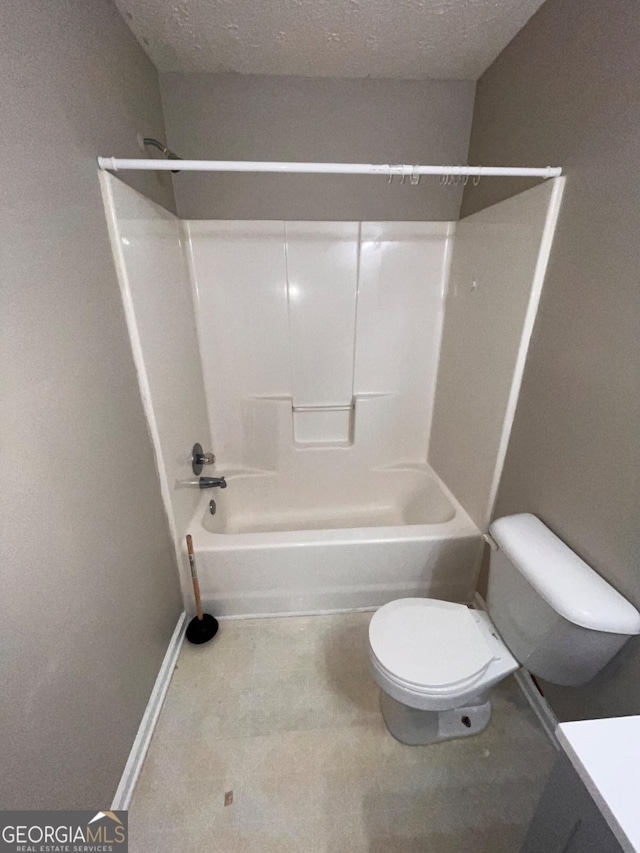 full bathroom featuring vanity, toilet, bathing tub / shower combination, and a textured ceiling